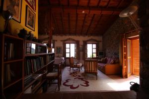a living room with a couch and a table and chairs at Villa Symbola in Oludeniz