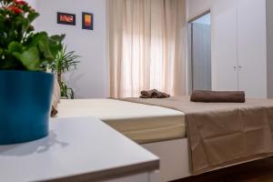 Postel nebo postele na pokoji v ubytování CASAMINA