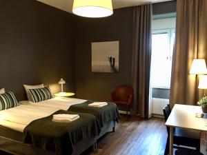 Postel nebo postele na pokoji v ubytování Sidsjö Hotell & Konferens