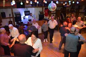 a group of people dancing in a room at Hotel Krone in Tauberrettersheim