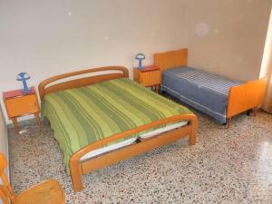 Ліжко або ліжка в номері A casa di Mauro
