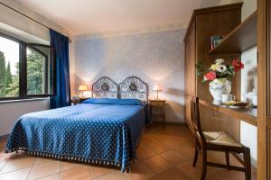 Postel nebo postele na pokoji v ubytování B&B Ponte a Nappo San Gimignano