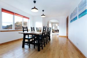 a dining room with a table and chairs at Skye View in Glenelg