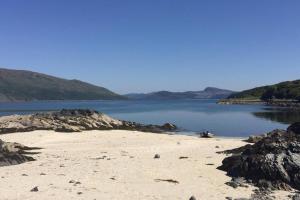 a beach with a view of a body of water at Skye View in Glenelg
