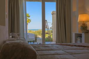 Кровать или кровати в номере Relais Masseria Caselli