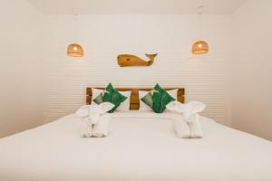 Postel nebo postele na pokoji v ubytování Whalecome Aonang Resort-SHA Extra Plus