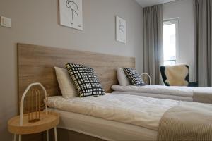 Posteľ alebo postele v izbe v ubytovaní Apple Green Apartments