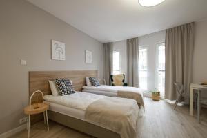 Posteľ alebo postele v izbe v ubytovaní Apple Green Apartments