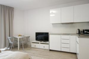 Kuchyňa alebo kuchynka v ubytovaní Apple Green Apartments