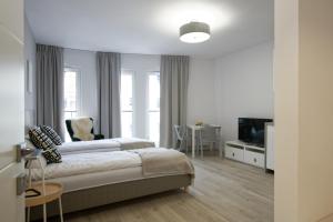Posteľ alebo postele v izbe v ubytovaní Apple Green Apartments