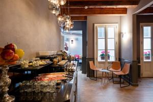 a kitchen with a buffet of food on a table at The Frame Hotel in Florence +99 photos