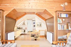 a kitchen and dining room in a tiny house at The Boathouse in Glencoe