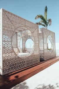 a rendering of a metal structure with two mirrors at Antera Hotel & Residences in Playa del Carmen