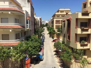 an empty street in a city with buildings at Furnished apartments Family only in Tangier