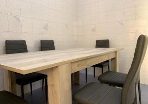 a conference room with a wooden table and chairs at Luxury Sorrento House in Sorrento