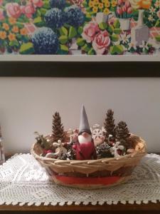 a basket filled with christmas decorations on a table at Casa Belfiore Da Andrea in Ferrara
