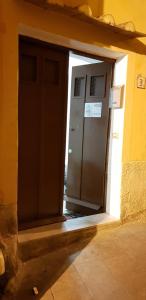 an entrance to a building with a door open at Sedile Del Campo House in Salerno