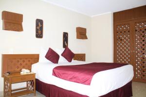Postel nebo postele na pokoji v ubytování Hotel Plaza Kokai Cancún