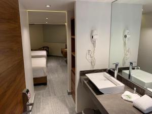 Koupelna v ubytování Hotel Plaza Kokai Cancún