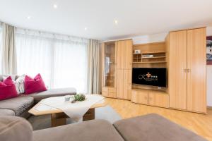Televízia a/alebo spoločenská miestnosť v ubytovaní Art-Apartments Kartnaller superior