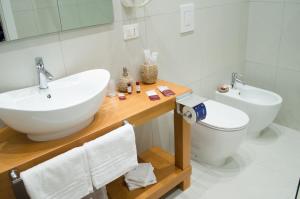a bathroom with a sink and a toilet at B&B Sosta Flegrea in Naples +30 photos