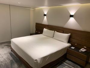 Postel nebo postele na pokoji v ubytování Hotel Plaza Kokai Cancún