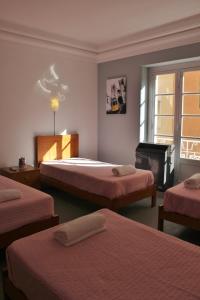 Katil atau katil-katil dalam bilik di Residencial Duque de Saldanha