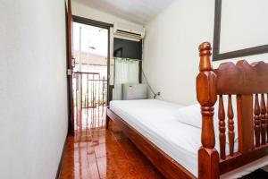 Postel nebo postele na pokoji v ubytování Hotel Flor Blanca
