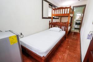 Postel nebo postele na pokoji v ubytování Hotel Flor Blanca