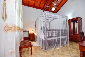 Voodi või voodid majutusasutuse Simon's Lodge Hikkaduwa toas