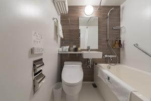 a bathroom with a toilet and a sink and a tub at Kyoto Gion U-BELL Hotel in Kyoto +41 photos