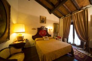 Postel nebo postele na pokoji v ubytování Hotel Castello Di Vigoleno