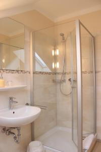a bathroom with a shower and a sink at Pension Weindl in Notzing