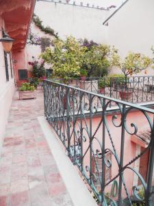 a balcony with potted plants on a building at Locanda di Porta Antica in San Benedetto del Tronto