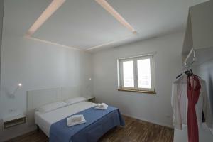 Llit o llits en una habitació de apARTments Sperlonga