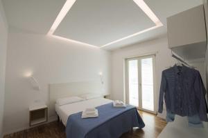 Llit o llits en una habitació de apARTments Sperlonga