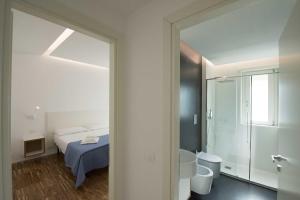 Llit o llits en una habitació de apARTments Sperlonga