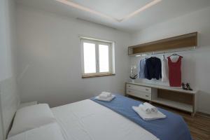 Llit o llits en una habitació de apARTments Sperlonga