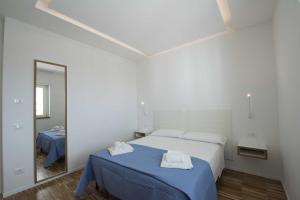 Llit o llits en una habitació de apARTments Sperlonga
