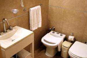 a bathroom with a sink and a toilet at Prince Hotel in Mar del Plata