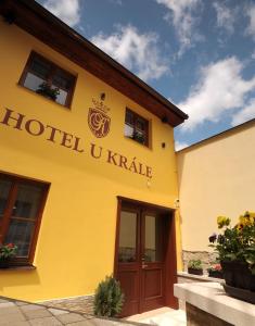 a yellow building with the words hotel ukraine at Hotel U Krále in Jičín