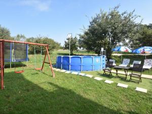 a playground with a seesaw and a swing at Premium Apartment in Barban with Private Pool in Šajini