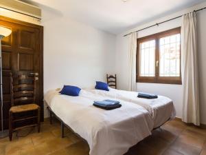 A bed or beds in a room at Modern Villa in Murla with Private Pool