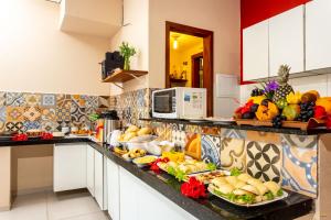 Cucina o angolo cottura di i9 Embaú Flats & Suites