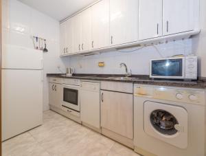 Kuchyňa alebo kuchynka v ubytovaní Gestión de Alojamientos Apartments