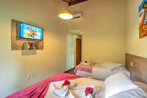Letto o letti in una camera di i9 Embaú Flats & Suites