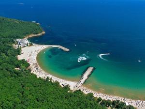 an aerial view of a beach with a boat in the water at Kovachevi House in Primorsko