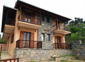 a building with balconies on the side of it at Panorama Vytinas in Vitina