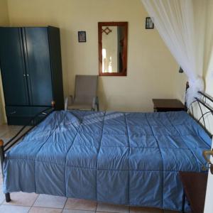 Posteľ alebo postele v izbe v ubytovaní Rigos Apartments