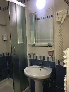 a bathroom with a sink and a shower at Villa La Kola Krusevo in Kruševo +25 photos